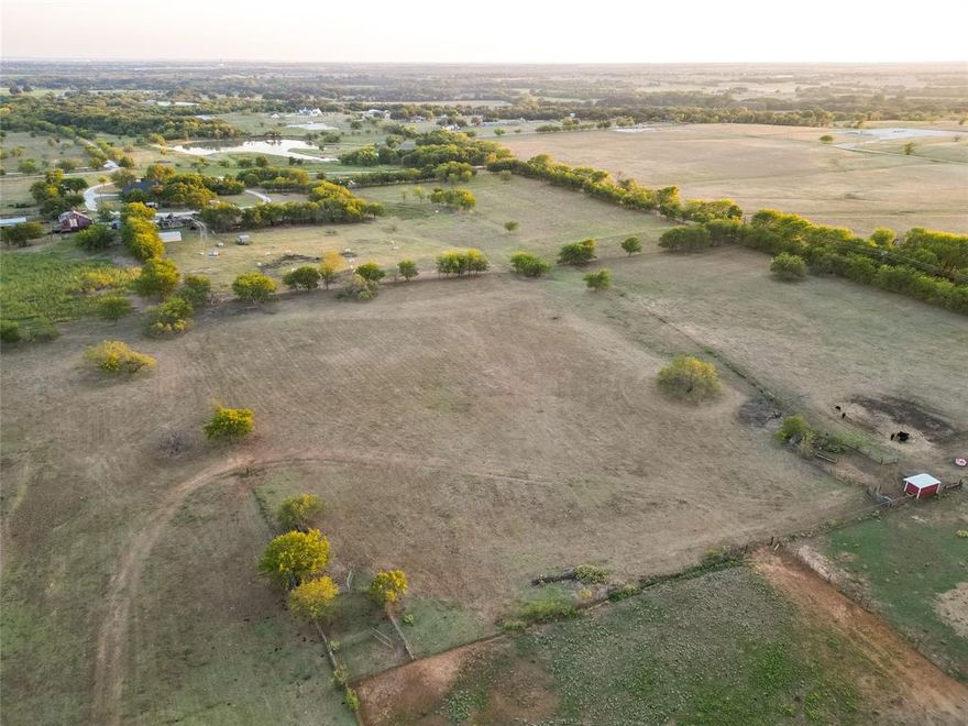 Beautiful 31+ acre lot located in Justin. This property features a great opportunity for you to own a personal homestead or divide into smaller tracts. Great roads to the property. Located in the highly sought after Ponder ISD. New buyer will need to speak with the Town of Ponder for any requirements regarding utility services. Buyer and buyers agent to verify all MLS information. *Seller is willing to entertain offers to sell adjoining 9+ acres with home, shop and two additional garages.