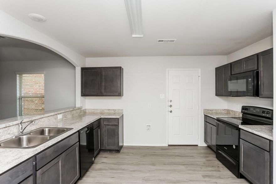 The Blakeford Plan is a popular one-story home featuring 3 bedrooms and 2 bathrooms. The open-concept layout brings together the living and dining areas for a spacious main living space. The primary suite is set at the back of the home and includes a walk-in closet and private bathroom. The two additional bedrooms are located on the opposite side with convenient access to the second full bath. A walk-in pantry and two additional hallway closets provide added storage throughout. Features include wood-grain vinyl plank flooring, a two-car attached garage, fenced backyard, and sprinkler system. All homes are SimplyMaintained for a $100 monthly fee that includes front and back yard lawn care and exterior pest control. Christian Meadows is a quiet neighborhood in Ennis, TX, with easy access to Highway 287 for convenient commuting. The community is part of the Ennis Independent School District, offering excellent schools nearby. Residents enjoy local shopping and dining, with Bluebonnet Park just a short drive away, perfect for outdoor activities and relaxation. Christian Meadows offers a peaceful suburban lifestyle with convenient access to local attractions and amenities.