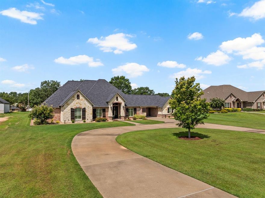 Step into luxury living at this impeccable property in Legacy Park. 3 Bedroom + Office, and 3.5 Bath. From the grand entry to the formal dining room, office, and inviting living room with a cozy fireplace, every detail of this home exudes elegance. The eat-in kitchen is a dream with granite counters, top-of-the-line appliances, and ample cabinetry. The primary suite offers a true retreat with an ensuite bath featuring a soaking tub, glass showers, and dual vanities. Hosting guests is a pleasure with two guest rooms, one featuring its own ensuite, and convenient half bath. Entertain effortlessly on the back porch with a built-in kitchen and bar, while the patio offers a serene spot to unwind and watch the kids play in the fenced yard. This is the perfect home for those who appreciate luxury and comfort in every corner. Don't miss this unprecedented opportunity to own a piece of Legacy Park in Pittsburg!