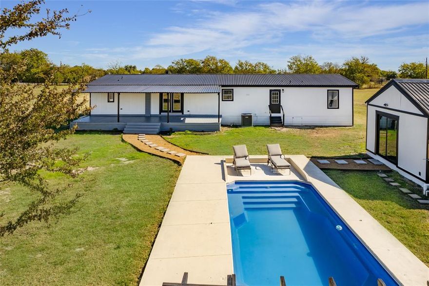 Country retreat with room for everyone and everything! This beautifully updated 5-bedroom, 2-bath home sits on 18 acres of gently rolling land with a perfect mix of open pasture and shady trees. Step inside to find modern finishes and a bright, open layout designed for comfortable country living.
Outside is where this property truly shines enjoy summer days in the in-ground pool and evenings by the pool house. There’s also a tiny house for guests or extra income, a horse barn, and a large storage shed for all your equipment and toys.
With easy access to Highway 24, you’ll have the perfect blend of privacy and convenience. Whether you’re looking for a family homestead, hobby farm, or weekend getaway, this property offers endless possibilities.