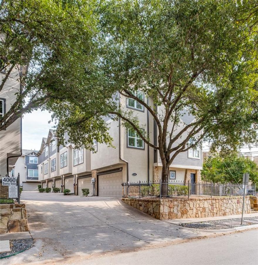 Walk your dog, play tennis or pickleball at nearby Cole Park, or take a quick stroll to the Katy Trail—accessible just a few minutes away. This stunning end-unit townhome offers a rare privately fenced yard, fire sprinkler security system and a host of recent upgrades, including new luxury vinyl flooring throughout, fresh interior and garage paint, and modern lighting fixtures. The spacious, open-concept living area features 12-foot ceilings, a cast-stone gas fireplace, oversized crown molding, a powder bath, and a designated utility closet. The updated kitchen impresses with current stainless steel appliances (including a gas range), quartz countertops, freshly painted cabinetry, modern fixtures, and ample counter space. Refrigerator conveys with the property. Upstairs, the third floor hosts two bedrooms and two full baths, each with new contemporary faucets and mirrors plus generous closet space. The primary suite includes a new modern soaking tub. Abundant natural light filters through plantation shutters on both levels. Enjoy the safety and convenience of a two-car garage with a large storage closet. Located within walking distance to dining, shopping, and entertainment, this home offers the perfect blend of urban living and neighborhood charm.
