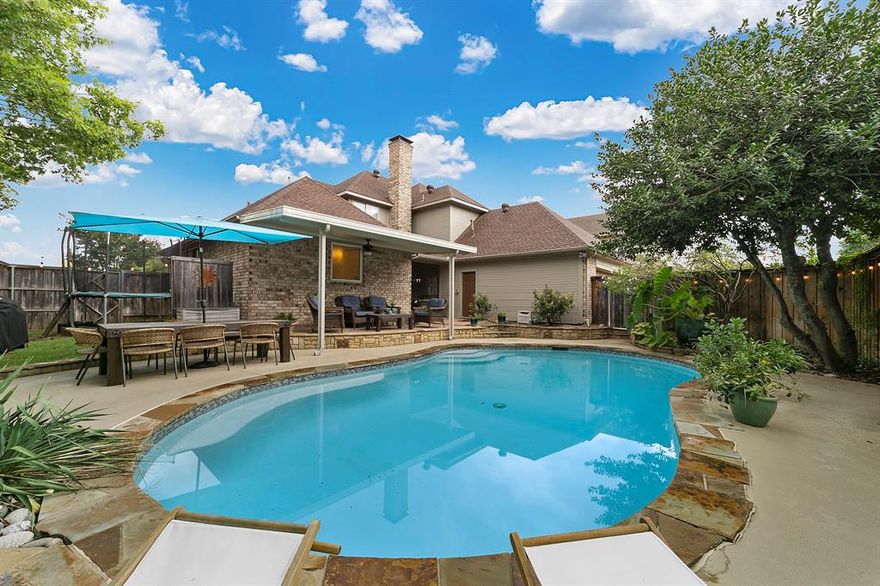 You’ll fall in love with this stunning home from the moment that you walk in through the large updated double doors and into the spacious living and dining room. Vaulted ceilings, hardwood floors and tons of natural light are just a few of this home’s charms. Primary suite is on main floor and the newly updated ensuite features elegant marble, designer lighting, deep soaker tub, glass shower, and dual walk-in closets. You find another spacious bedroom on the main floor connected to a gorgeous full bath, perfect for guests or as in-law suite. Step outside to enjoy the sparkling saltwater pool and mature landscaping from one of two covered outdoor seating areas. Head upstairs to the two guest rooms with large windows and hardwood floors or enjoy the spacious second living area-game room for a movie night. Kitchen features granite counters, double ovens and is ready for family meals and memories to be made. Don’t miss your chance to make this beauty your forever home.