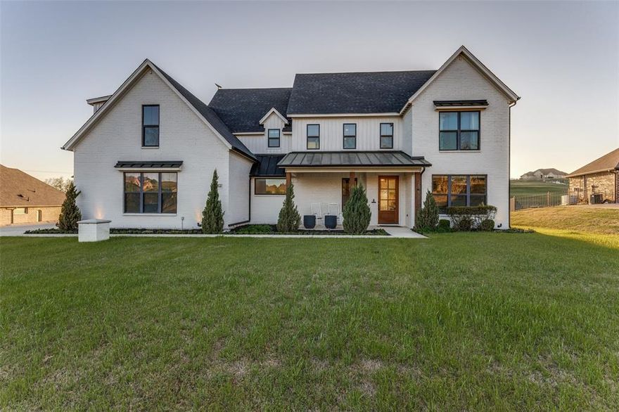 Welcome to this stunning home in Bella Ranch, where luxury, space, and thoughtful design come together on almost 2 acres! Including partial ownership of a large, scenic pond. This 4-bedroom, 4-bath residence offers an ideal layout for modern family living, complete with a 3-car garage and over 3,800 square feet of beautifully curated space.

Built in 2020 and thoughtfully updated in 2022, the home features a refreshed transitional kitchen designed to feel timeless, warm, and perfect for gathering, cooking, and making memories. The flow of the home feels cozy yet impressively spacious at the same time.

The sprawling backyard is truly special, offering breathtaking sunsets and a resort-style pool and spa by renowned Southlake builder Claffey Pools, making it ideal for both everyday enjoyment and entertaining.

The home includes two bedrooms downstairs and two upstairs, creating flexibility and privacy. Upstairs, you’ll find a fully loaded movie room with 7.2 surround sound, a top-of-the-line 4K laser projector, and a 120” screen, along with a huge game room that’s perfect for entertaining guests. The pool table and upstairs wine fridge will convey.

Additional highlights include:
• Fully customized garage with heavy-duty metal cabinetry and epoxy floors
• Alexa-enabled Lutron power shades throughout most of the home
• Small office space downstairs with a hidden door and secret storage under the staircase

This home is perfect for the most discerning buyers, and offers an ideal layout that feels both cozy and extremely spacious in one of the most desirable settings within Bella Ranch.