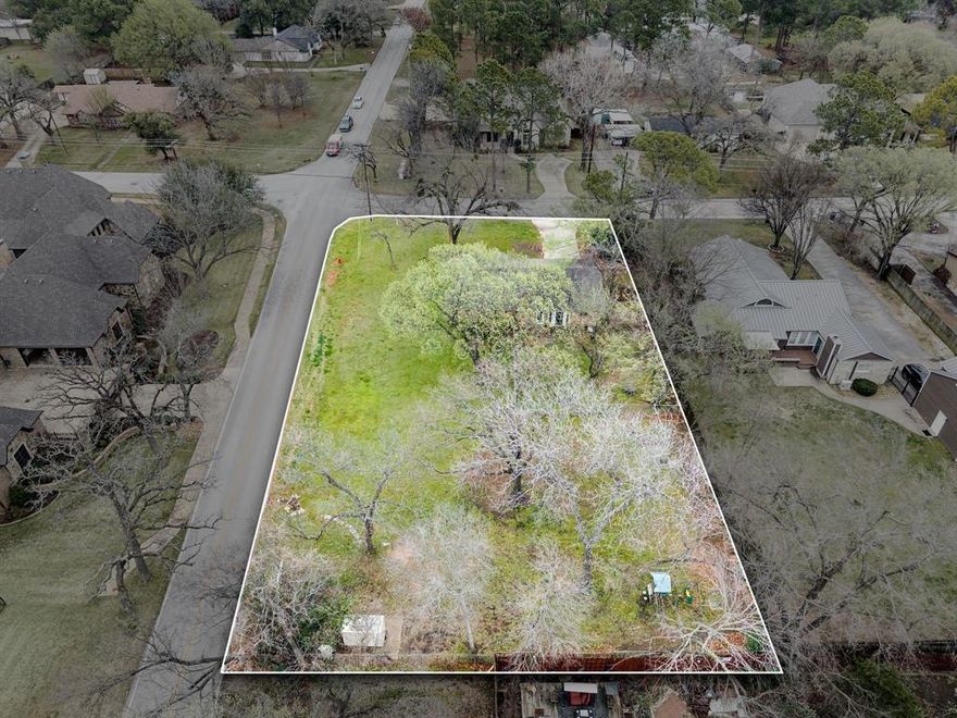 Build your dream estate in the heart of Colleyville. This nearly half-acre corner lot offers the perfect canvas for a custom luxury home. The existing house is older and will likely be removed, making this an ideal tear-down and rebuild opportunity. The lot is enhanced by several large, mature trees that create a beautiful natural setting and timeless curb appeal. Surrounded by stunning estate properties, this is a unique chance to secure a generous homesite in one of Colleyville’s most desirable areas.