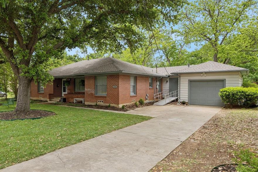 Pride of ownership shines in this well-maintained 3-bedroom home, lovingly cared for by the same owners for over 31 years. Located on an oversized lot with mature shade trees, recent updates include a new roof, refreshed landscaping, AC compressor replacement with full system tune-up, updated bath, new carpeting in family room and fresh interior paint throughout. This home offers a solid foundation with thoughtful improvements already in place. Perfect starter home or investment property conveniently located near downtown Arlington and UT Arlington. The existing medical access ramp will remain, providing added convenience and accessibility.  Sellers are ready to downsize for retirement, creating a great opportunity for the next owner to make it their own.