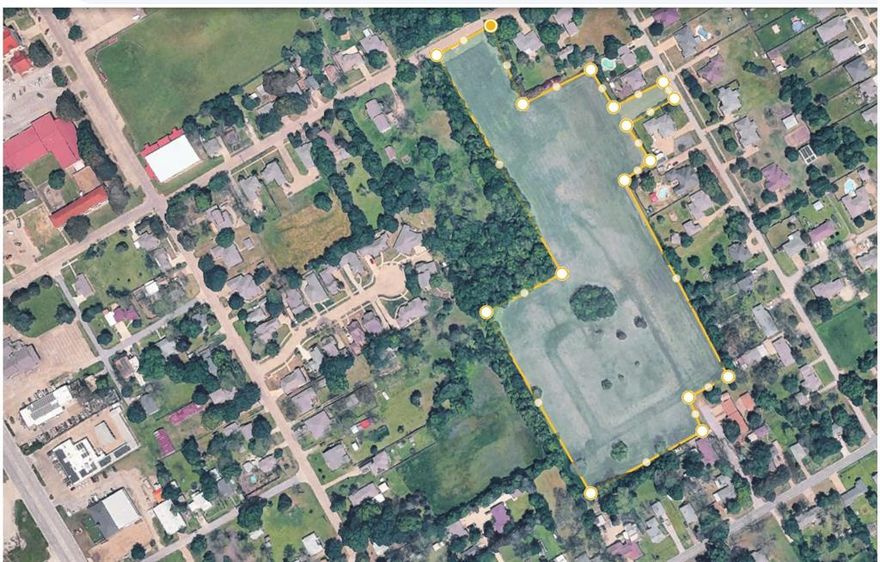 Prime development opportunity in the heart of Ennis! Situated at 900 S Elm Street, this approximately 11.65 acre property offers exceptional potential for residential development, investment, or future land hold. Existing R5 zoning may allow for 5,000 square foot single family lots, and a previously prepared site concept reflects the possibility of approximately 56 lots, subject to city approval and buyer verification. With water available at the site and sewer nearby, this tract is positioned for thoughtful growth in one of Ellis County’s expanding communities. Conveniently located near schools, local amenities, historic downtown Ennis, and major routes for commuting, this property offers the rare combination of acreage, location, and development potential inside city limits. Unapproved site concept plan is in transaction desk documents and offers one possible strategy for development.
