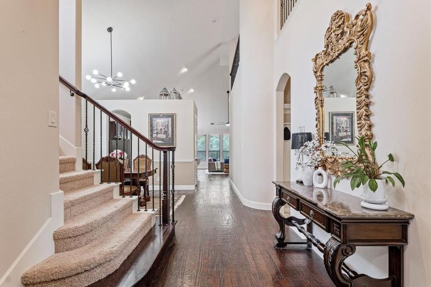 This beautifully maintained and updated 4 bedroom, 3.5 bath stunner home sits on a creek lot in a small, gated community and is zoned to desirable Richardson ISD schools and North of Lake Highlands. As you enter, you’re greeted by an open and inviting floor plan that seamlessly integrates the living, dining, and kitchen area. Home is light and bright with soaring ceilings, hand-scraped hardwood floors, updated kitchen with stainless steel appliances, gas cooktop, and large quartz countertop island that overlooks the living room and backyard. The spacious primary suite includes a bay window sitting area and an updated ensuite bathroom with walk-in shower, garden tub, dual vanities, and walk-in closet. Upstairs offers 3 bedrooms, 2 baths, 2nd living room or flex space and a media room offer endless possibilities for indoor leisure and entertainment. Escape to your own private getaway to the backyard that leads you to a private creek that will have you feeling like you’re on a retreat. A serene setting for both relaxation and entertaining. Also have peace of mind with an efficient tankless water heater, Energy Star efficient, and newer roof (march 2024) home. Enjoy the creek view backyard boasting a covered patio, wood decking, and grassy area for pets.