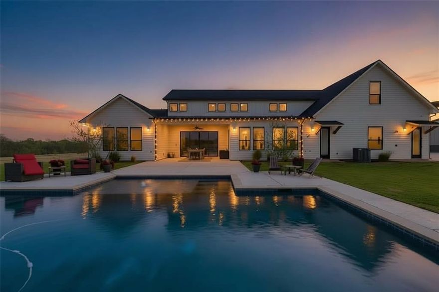 Welcome to 338 CR 4223 in Decatur—set on 10 ag-exempt acres with a pool, this custom modern farmhouse was designed for upscale living and effortless entertaining. Offering 3,372 SF, the home opens to a stunning great room with soaring 18-foot ceilings, seamlessly connecting the family room, kitchen, and dining area. The chef-inspired kitchen features a professional grade gas cooktop, a stunning custom vent hood, TWO islands, abundant counter and cabinet space and premium finishes—built to gather and impress. The split-bedroom layout is smart and includes four bedrooms, with a private primary suite and guest suite (both with ensuites) on the main level, and two spacious secondary bedrooms upstairs. A total of five bathrooms includes three full, one half, plus a dedicated pool bath with outdoor shower access. Three indoor living areas provide flexibility: the main great room with dramatic see thru fireplace, a sunroom (den) that shares the see thru fireplace while offering patio access, and an upstairs game room positioned over the garage for added privacy and noise separation. Two home offices offer versatility—one with a fireplace ideal for a study or library, and another with a secure safe closet for practical needs. Outdoors, enjoy a covered north-facing patio overlooking the pool that is backdropped by Texas sunsets! The EXTRA extras include an oversized three-car garage with EV capability, a 48x36 shop with electric & plumbing, a walk-in floor-to-ceiling shelved pantry with wine fridge, a spacious laundry room with a sink & utility storage, outdoor mosquito misting system, custom cabinetry, wood floors, layered interior lighting, thoughtfully planned outdoor lighting and a water softener system.
No restrictions—bring your animals, RVs, ATVs, and more.