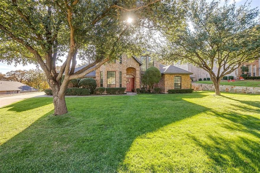 Beautiful home on Browns Mountain on a Gorgeous treed lot. Two 2 car garages & RV parking with elect. Beautifully updated 4 bedroom, 3 full & 1 half bath home with two living & two dining areas. Luxury vinyl plank flooring throughout. Large family room with brick wbfp & heatilator with open concept floorplan. Formal dining off entry with bay windows. Chefs delight kitchen with huge island, quartz countertops, new appliances & cabinets with an abundance of storage open to large breakfast nook & family room. Primary suite has separate office or exercise room, ensuite has quartz countertops, new separate vanities, jetted tub & separate shower. Large utility room has built in cabinets & large folding area. Two addt'l bedrooms downstairs with one full bath and one half bath. Upstairs boasts game room with wet bar, a fourth bedroom with full bath & a flex room for a study or craft room. Upstairs balcony overlooks large backyard.  Large covered patio with half bath outdoors and private alley.