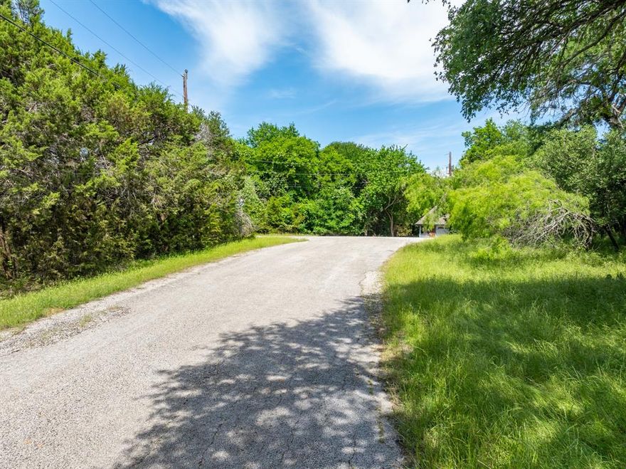 OWNER WILL FINANCE!!! Located near the Old Course and just under a mile from the marina, this prime piece of land offers a serene setting with easy access to lake activities, boat ramps, pools, tennis courts, restaurants, 72 rounds of gold yearly, and other resort amenities. You can experience the tranquility of nature, mature trees, and the peaceful atmosphere of a gated community, while staying within commuting distance to DFW and Waco. Whether you're planning a full time residence or just a weekend getaway, this .3 acre lot is ready for your vision. Come visit today!