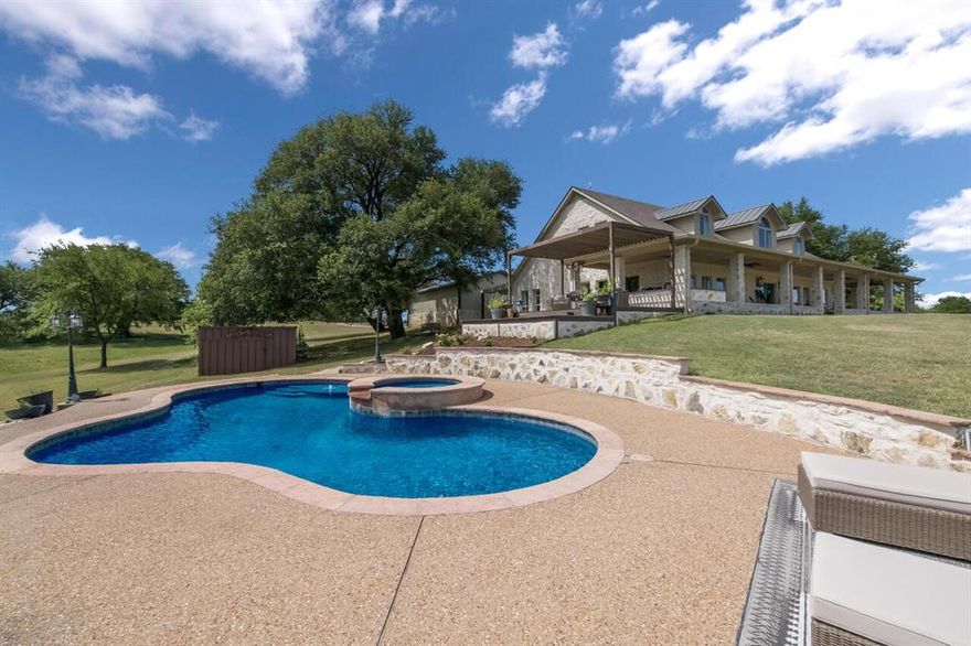 Masterfully planned HILLTOP estate overlooking a spring fed creek in a gorgeous Bosque County setting just minutes to Lake Whitney, China Spring and Clifton! This 30 acre property has a country resort like feel with a gorgeous pool, HUGE porches, a
MASSIVE workshop with quest quarters. brand new 3 car garage. a stunnina gated entry-wav with pavina the entire wav to the house and much much more! The main home features 3,999 square feet of living space that has been GORGEOUSLY redesigned with luxury finishings and details throughout each room that look straight out of a magazine. There are 4 spacious bedrooms, 3 full bathrooms, a STUNNING dining area, decked out kitchen, cozy living space and a dreamy and secluded master suite that is downstairs. The upstairs has a loft flex space, gun room and wonderful views throughout each space. On the exterior you will
entov endless entertainina and recreational oddortunities. From watching deer and wild turkev from the tront dorch to hiking down the rocky flowing creek your guests will be blown away by every detail on this property. They will also enjoy staying in the equally as well designed guest apartment that sits within the large workshop. This property has been updated with all new energy efficient AC units, spray foam insulation and even a 75,000 kw 187 watt generator that will immediately kick in if there is ever a power outage. This property is even more impressive in person and is ready for you to call it your own!