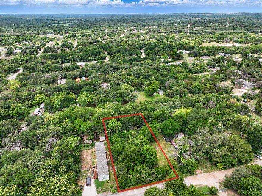 Opportunity Awaits in Lake Granbury Harbor! 

This spacious lot offers the perfect blank canvas for your future home. It holds incredible potential for your custom build home, barndominium or a mobile home. Located in the desirable Lake Granbury Harbor community, you'll be just minutes from the lake and the charming shops and restaurants of downtown Granbury. The property will need to be cleared but once completed you'll have free firewood and mulch. Whether you're looking to build from the ground up or bring in a mobile home, this lot offers flexibility and a great location to make your vision a reality.