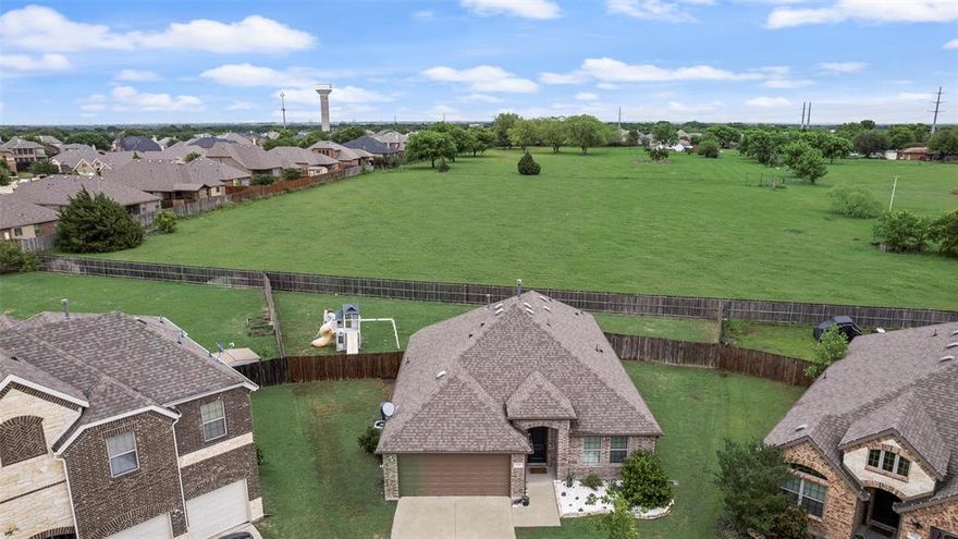 Nestled in the sought-after master-planned community of Woodcreek and zoned to Rockwall Independent School District, this 4-bedroom, 2-bath home combines comfort, space, and versatility. Positioned on an oversized cul-de-sac lot, it offers added privacy and room to enjoy outdoor living. Inside, an open-concept layout creates a seamless flow between living, dining, and kitchen spaces—perfect for entertaining. The flexible fourth bedroom provides the ideal option for a home office or guest room. A standout property in a thriving community.