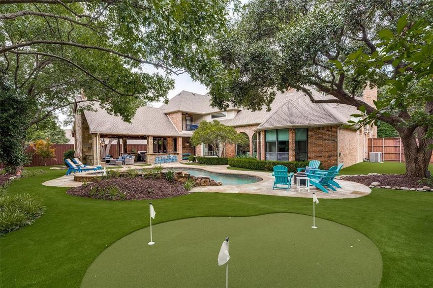 Extraordinary opportunity to own a beautifully updated move-in ready custom home in the exclusive luxury section of Shoal Creek. On a quiet cul-de-sac, this stunning residence rests on an expansive, heavily treed lot just shy of half an acre, offering unmatched privacy and serenity. The home showcases impeccable quality and detail throughout. Warmth and natural light flood the interiors with floor-to-ceiling windows and richly refinished hand-scraped hardwood floors. The thoughtfully designed layout features the primary suite, a secondary bedroom and a large-executive office on the main level, while upstairs you’ll find three bedrooms, two bathrooms and a large game room. The kitchen has been beautifully updated with painted cabinetry, large island with quartzite countertops, subzero fridge, double oven, a new cooktop, microwave, and dishwasher and flows seamlessly into the living and breakfast areas, making it a central gathering space. The large dining room is wonderful for Holiday gatherings with a butler’s pantry and wine fridge. The primary retreat offers a cozy fireplace, tray ceiling, bay windows, a sitting area, and direct access to the patio and a newly remodeled spa-inspired bathroom features all-new cabinetry, tile, a frameless glass shower, freestanding tub and elegant countertops. All additional bathrooms throughout the home have also been stylishly updated. Outdoor living is Texas-sized and truly spectacular, featuring an oversized covered patio with an outdoor living space and kitchen, a pool with spa enhanced by modernized equipment, including new pumps, filtration and heating systems, a 3-hole putting green, artificial turf throughout the backyard, extensive landscape lighting and multiple lounging and dining areas—ideal for both quiet evenings and lively gatherings. It is the perfect blend of luxury, comfort, and lifestyle—just minutes from premier shopping, dining, Legacy West, the Dallas North Tollway and several Fortune 500 company headquarters.