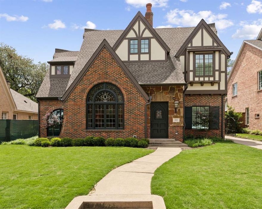 Welcome to 4515 S. Versailles Avenue, a masterfully reimagined 1929 Tudor nestled in the coveted French Streets of Highland Park. Thoughtfully renovated by renowned designer Ellen Grasso, and upgraded by the current owner, this exquisite residence marries the enduring charm of classic architecture with sophisticated modern living.

Step inside to discover soaring 13-foot vaulted, beamed ceilings and stunning leaded glass windows that flood the interiors with natural light. The grand living room sets a dramatic tone, while arched entries and elegant detailing add warmth and refinement throughout.

The heart of the home is the gourmet kitchen, appointed with Thermador appliances, gleaming white marble countertops, and a spacious island perfect for entertaining. The kitchen opens effortlessly into a comfortable family room and sunny breakfast nook, creating a seamless space for gathering.

The primary suite is a serene retreat, featuring an 11-foot beamed ceiling, a luxurious marble spa bath with heated floors, dual vanities, a soaking tub, double shower, and a custom walk-in closet with its own center island.

With five spacious bedrooms, each with its own ensuite bath, a stylish office, and a private guest suite on the main level, the home offers exceptional flexibility for both everyday living and hosting.

Outdoors, enjoy a lushly landscaped backyard with a covered terrace and built-in outdoor kitchen—perfect for al fresco dining and entertaining. The two-car detached garage is equipped with HVAC, and additional conveniences include an automatic gate, putting green, and custom rain gutters.

Located just steps from iconic Flippen Park and within walking distance to Highland Park Village and top-rated Bradfield Elementary, this is a rare opportunity to own a piece of history in one of Dallas’s most prestigious neighborhoods.