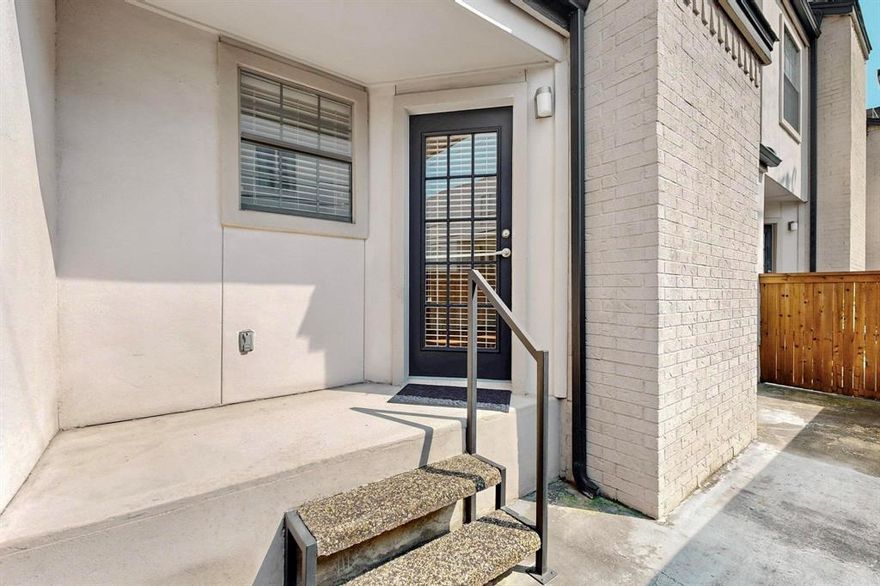 Welcome the Parks on Travis Condos, a gated community in a highly walkable Uptown Dallas location—walk to Knox-Henderson, Katy Trail, West Village, Turtle Creek & multiple neighborhood parks! This two-story unit has been thoroughly cared for, boasting recent updates throughout: FRESH PAINT, BOTH BATHROOMS REMODELED + ALL MAJOR SYSTEMS SERVICED. Versatile first-floor layout includes the main living room, galley-style kitchen, refreshed powder room & formal dining or second living area featuring a wood-burning fireplace. Skylights & vaulted ceilings make for great natural light throughout. Kitchen is complete with granite countertops, ample cabinet storage, SS appliances & reverse osmosis water filtration system—plus easy access to the unit’s private patio right off the kitchen—great for indoor-outdoor entertaining! All downstairs flooring redone in 2015. NEW carpet on staircase + second floor (2025). Primary suite upstairs boasts more high ceilings, room for seating & a spacious ensuite fully remodeled with all new fixtures, accent tiling & walk-in glass shower. Second bedroom or office space adjacent to the primary. Use as a guest room, study, or workout room! Laundry conveniently located upstairs next to walk-in closet space. Community amenities include a sparkling pool, gated & secured entrances, parking garage & low HOA fees. Private storage unit + two parking spaces included. All in an UNBEATABLE LOCATION in the heart of Dallas, steps to parks, schools, shopping, dining & entertainment for all ages!