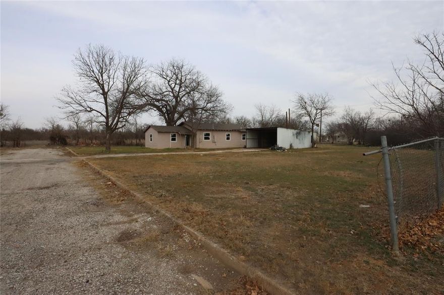 This is a fixer upper. Work was started but needs to be finished out but a lot has been done already. Has new windows, a new roof, new framing, new plumbing and electrical, sits on a huge lot at the end of a culdesac and has a large carport. The fence shows the lot size