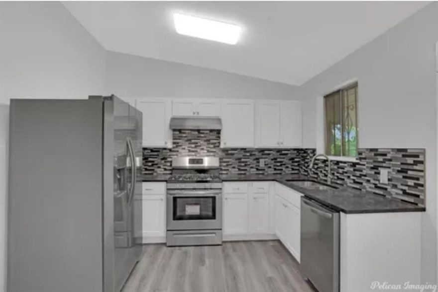 First time homebuyers or anyone looking for affordable modern upgrade in Shreveport. This just might be what you've been looking for. Don't let the modest exterior fool you because this 3-bedroom 2 bath hidden gem shines from the inside out. This home has been fully renovated and modernized to offer both comfort and style. Step inside to discover a stylish open floor plan with brand new laminate flooring, and fresh gray interior color scheme, and modern stainless-steel appliances. This kitchen stands out with its white cabinetry, and striking, gray-toned mosaic tile backsplash that adds depth and character. Did I mention that this home has NO carpet which makes cleaning a breeze? Plus, it features spacious closets perfect for storing all your essentials. The bathroom continues the same sleek, modern aesthetic found throughout the home, offering both style and comfort in every corner. Furthermore, the spacious back yard given great space for entertaining with a fully fenced yard with double gate for peace of mind. Come see it for yourself the inside speaks volumes!!
