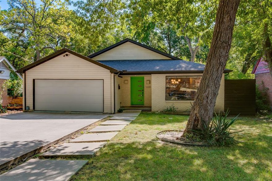 Discover this 1950s charmer in Beckley Club Estates, a special Oak Cliff neighborhood known for its tight-knit community, wooded hills, and wandering peacocks.This delightful home features 3 bedrooms and 2 bathrooms. The primary bedroom features large windows, a walk-in closet, and a spacious bathroom with a dual vanity, a soaking tub, and a walk-in shower. The open-concept kitchen and living area are bathed in natural light, with the kitchen offering a stylish blend of quartz and butcher block countertops for both aesthetic appeal and practical use. Additional highlights include a convenient laundry room and an attached 2-car garage. The large backyard deck overlooks a wonderfully shaded yard, offering privacy thanks to tall bamboo and a board-on-board fence. Its location provides easy access to downtown Dallas and is just moments away from popular attractions like Bishop Arts, the Dallas Zoo, and the upcoming Halperin Park.