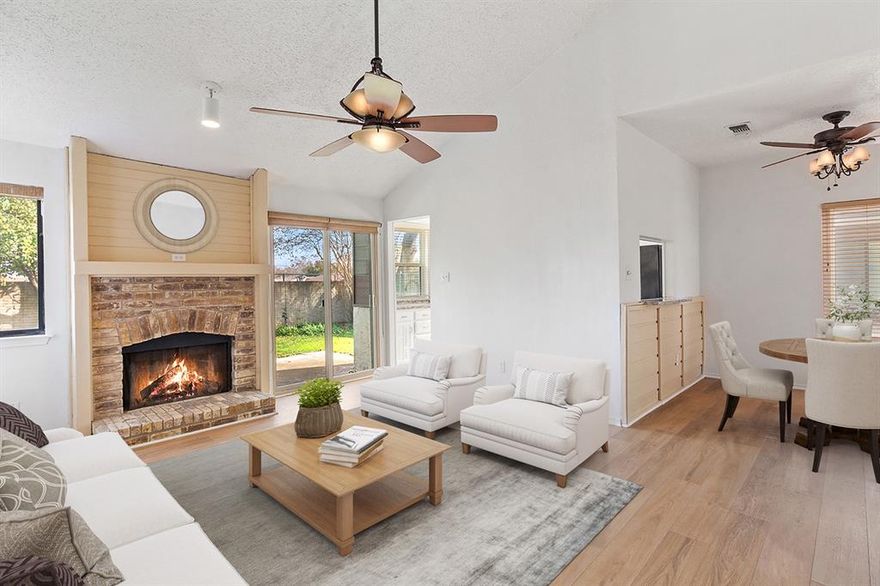 One of only a handful of units offering a generously sized private backyard—perfect for pets, play, or entertaining. Ideally located just minutes from major highways, shopping, and dining, with highly-acclaimed Richardson schools, the community pool, and play areas all within walking distance. This move-in-ready 2-bedroom, 2-bath condo features dual ensuite bathrooms and thoughtful updates throughout. Recent improvements include fresh interior paint, luxury vinyl plank flooring in the main living areas, new windows in the common spaces, and a new sliding glass door leading to the backyard. The inviting living room showcases vaulted ceilings, a charming bench seat, and a wood-burning fireplace that serves as a striking focal point—perfect for cozy evenings and holiday décor. The breakfast bar is stool-ready for casual dining and morning coffee, complemented by polished granite countertops and a modern color palette. The updated kitchen offers stainless steel appliances, crisp white cabinetry with brushed hardware, and a double-bowl sink with a tower faucet and pull-down sprayer. Large dual windows over the sink provide abundant natural light and views of the backyard. The primary suite features soaring ceilings and an ensuite bath with dual vanities, ample storage, a spacious walk-in shower, and an impressive wall of closets. Additional upgrades include a new kitchen sink and disposal, primary toilet, and appliances—including refrigerator, washer, and dryer—all of which convey. HOA covers roof, roads, clubhouse, swimming pool, and maintenance of common area fixtures, including fencing.