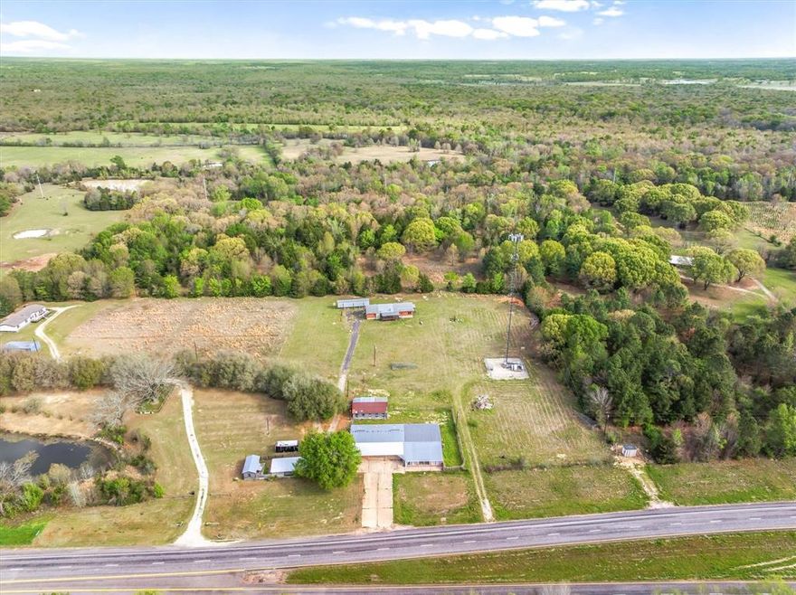 If you’ve been looking for country living with incredible potential, this property is a rare find! Nestled on 2.4 acres with HWY 80 road frontage, in Van ISD, this charming 3-bedroom, 2-bath home offers approximately 1,478 square feet of comfortable living space!!! The home features a log-cabin style exterior, giving it a cozy country feel, along with a beautiful stone fireplace that makes the living area warm and inviting. Enjoy the outdoors from the spacious front and back porches, with a ramp on the front porch for easy access. Location is another highlight, this property sits right between two charming small towns, Grand Saline & Mineola, offering quick access to groceries, local shops, and several great restaurants while still enjoying peaceful country surroundings. What truly makes this property stand out is the 6,000 SQ.FT commercial building located on Highway 80, offering endless possibilities for business opportunities. Whether you’re dreaming of running a small business, creating a workshop, or investing in future potential, this property allows you to live and work all in one place. The home was built in 2000 and is ready for its next owner to make it their own. With a little TLC and updates, this property has the potential to become something truly special. Opportunities like this, combining a home, acreage, and commercial potential in a great location, don’t come along often!!! Don’t miss this one!!