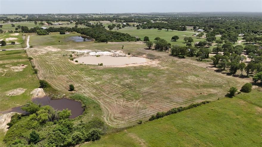 OWNER FINANCING ALSO AVAILABLE! Experience the ideal balance of tranquil country living and easy access to town amenities with this beautiful 14.43 acre property. Offering expansive open space and endless potential, this property is ideal for building your dream estate or developing multiple homesites. Plans are already drawn for an RV park with clearing and leveling completed in order to prepare! This prime location offers commercial opportunities but is also tucked away from the road noise to still create a peaceful residential setting. 

Surrounded by the natural beauty and quiet countryside, this property provides a private atmosphere while remaining conveniently close to local shops, schools, and services. Whether you're seeking a serene retreat, a family homestead, or a smart investment, this rare find combines rural charm with modern convenience in a unique location. 

Don't miss the opportunity to turn your vision into reality—properties like this are becoming increasingly hard to find.