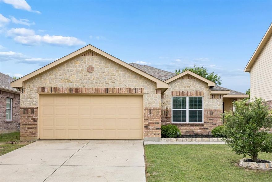 Welcome to this well-cared-for 3-bedroom, 2-bath home in the Twin Mills community of Fort Worth, located in Eagle Mountain-Saginaw ISD. With 1,556 square feet and a smart single-story layout, this home offers a comfortable blend of open living space and thoughtful updates that make it truly move-in ready. As you walk in, you’re greeted by an open floor plan that connects the living, dining, and kitchen area making it easy to stay connected whether hosting or enjoying a quiet night at home. The kitchen features granite countertops, a large island, stainless steel appliances, and a walk-in pantry, giving you plenty of space to cook and gather. Fresh interior paint and updated lighting in the main areas add a clean, modern touch, while wood flooring in the bedrooms brings warmth and character. The backyard has been fully refreshed with new grass, a new fence, and an updated sprinkler system for full coverage. A covered shade structure creates a comfortable outdoor living space—perfect for relaxing in the evenings or spending time with friends and family. The addition of permanent Jellyfish lighting adds both convenience and curb appeal, making it easy to enjoy year-round exterior lighting for holidays or everyday ambiance. The split-bedroom layout offers privacy, with the primary suite tucked away as its own retreat, complete with an en-suite bath and oversized shower. The additional bedrooms are well-sized and flexible for guests, a home office, or hobbies. Location is another standout here. You’re just a short walk to the neighborhood park and community pool, and only a quick drive to Eagle Mountain Park for hiking and outdoor time. Plus, you’ll appreciate the convenient access to the Fort Worth Stockyards, downtown Fort Worth, and plenty of nearby shopping and dining options. If you’ve been searching for move-in ready homes in Fort Worth with an open layout, updated features, and a great location, this one is sure to stop your search.