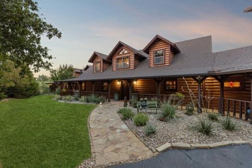 Every detail of its construction tells a story: the shell is crafted from exquisite blue pine sourced from Utah and Colorado, while the trim work is made of Western red cedar, and the staircase is fashioned from striking Ponderosa half logs. Inside, the home reveals an open-concept design, soaring ceilings, and expansive floor-to-ceiling windows that bathe the interiors in natural light. Beautifully crafted wood floors and ceilings, along with majestic stone fireplaces, add a sense of warmth and character to every room. PROOF OF FUNDS REQUIRED PRIOR TO SHOWING. 
The primary suite is a haven within itself, offering a cozy sitting area with a kiva-style fireplace, two walk-in closets, built-ins for added convenience, and private access to a home gym. Additionally, the suite opens to a loft space with limitless potential.
Adding to the allure of this property is a separate 1,629 sqft apartment. Complete with a living room featuring a fireplace, a dining room, a fully equipped kitchen, a spacious bedroom, a full bathroom, and a powder room, this additional space offers versatility for guests or extended family.
A 4-car garage with ample storage space further enhances the practicality of this home. This property is an extraordinary blend of natural beauty, thoughtful design, and unparalleled craftsmanship, inviting you to create your own retreat in a setting like no other