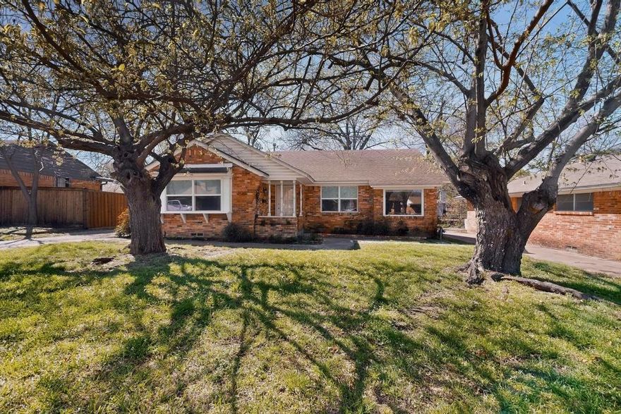 Charming ranch-style home tucked away on a cul-de-sac in an established East Dallas neighborhood, just an 8 minute drive to the Dallas Arboretum and White Rock Lake. Beautiful hardwood floors flow throughout the living areas and bedrooms, complemented by freshly painted interiors and well maintained finishes. The flexible floor plan offers two living areas and two dining spaces, including a formal dining area in the front living room and an eat-in kitchen dining area. The third bedroom also works well as a home office or study. Both bathrooms have been nicely updated with remodeled tile, fixtures, and finishes. The home has been wonderfully maintained over the years with numerous improvements including Marvin Infinity replacement windows (2023), stainless steel kitchen sink and stainless steel refrigerator (2023), plumbing cut-offs added throughout the home (2023), HVAC system (2012), and water heater (2018). The backyard backs to White Rock Creek and features a covered patio. An 8 foot wooden privacy fence was added along the driveway (2023), providing additional privacy to the outdoor space. Attached two car garage.