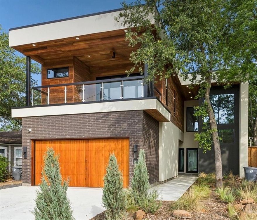 Located in Little Forest Hills and in close proximity to White Rock Lake and the Dallas Arboretum, this new construction home features 3,951 square feet of comfortable living space with five bedrooms and five full baths, including a secondary primary bedroom with dual vanities and custom closets, level 5 walls and paint, 2-car garage, and a fully turfed yard with beautiful magnolia trees. Upon entering, soaring ceilings greet you with abundant natural light from the large windows that looks  into the yard, the hallway leads you into the open concept kitchen, dining and living areas. The chef’s kitchen is outfitted with Sub-Zero and Wolf appliances and is highlighted by the custom island with fluted quartzite. Also located on the main level is a guest bedroom with custom built-ins along with the large primary suite that features a spa like bathroom with an oversized european custom closet. The second floor features a large gameroom area surround by windows that look into the beautiful surrounding trees. Upstairs you will also find the secondary primary bedroom that features a large balcony, dual vanity ensuite bath and custom closet along with two other secondary bedrooms. The backyard features a large patio, a dedicated grill area and plenty of space for entertaining or building a future pool.
