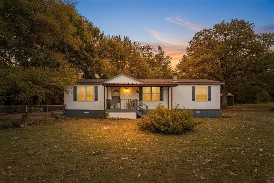 Welcome home to this charming, move-in-ready residence nestled on a peaceful, tree-lined lot with a creek running along the property, offering a serene natural backdrop and a true sense of privacy. From the moment you arrive, you’ll appreciate the inviting front porch and the tranquil setting that makes this home feel like a retreat.
Inside, the home features a warm and welcoming layout with durable wood-look flooring throughout the main living areas. The spacious living room is highlighted by a cozy fireplace, perfect for relaxing evenings, and large windows that bring in natural light. The neutral color palette pairs beautifully with the home’s character, creating a comfortable yet modern feel.
The kitchen offers ample cabinet space, sleek countertops, and stainless steel appliances, flowing seamlessly into the dining area—ideal for everyday living or entertaining guests. Bedrooms are generously sized, providing comfortable personal spaces, while the overall layout is both functional and inviting.
Step outside and enjoy the natural surroundings, where the included creek adds a rare and peaceful feature—perfect for nature lovers, outdoor gatherings, or simply unwinding in a quiet setting. With mature trees, open space, and a country-like atmosphere, this property offers the best of both comfort and nature.