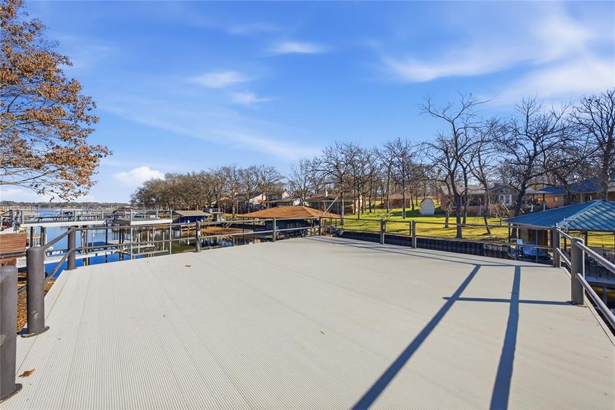 BONUS PROPERTY INCLUDED! Enjoy lakefront living with a rare two-home opportunity. This beautifully updated 4-bedroom, 2.5-bath lakefront residence includes a separate bonus home located directly across the street—both properties share the same water and electric service.
The main home features 2429 square feet with an open-concept living, dining, and kitchen area designed for easy entertaining, complete with a breakfast bar, granite countertops, and a built-in china cabinet. The living room offers stunning lake views, which are also enjoyed from the downstairs primary suite. The primary bedroom includes a spacious walk-in closet and private bath. Abundant storage is found throughout the home.
Step outside to a well-appointed boat dock featuring boat and jet ski lifts along with an aluminum top deck—perfect for enjoying lake days.
The bonus house offers 750 sq. ft. with 2 bedrooms, 1.5 bathrooms, and a 2-car garage , providing excellent income potential. It is suitable for use as a rental property, including short-term rentals. A unique lakefront package offering lifestyle and investment potential—don’t miss this exceptional opportunity.