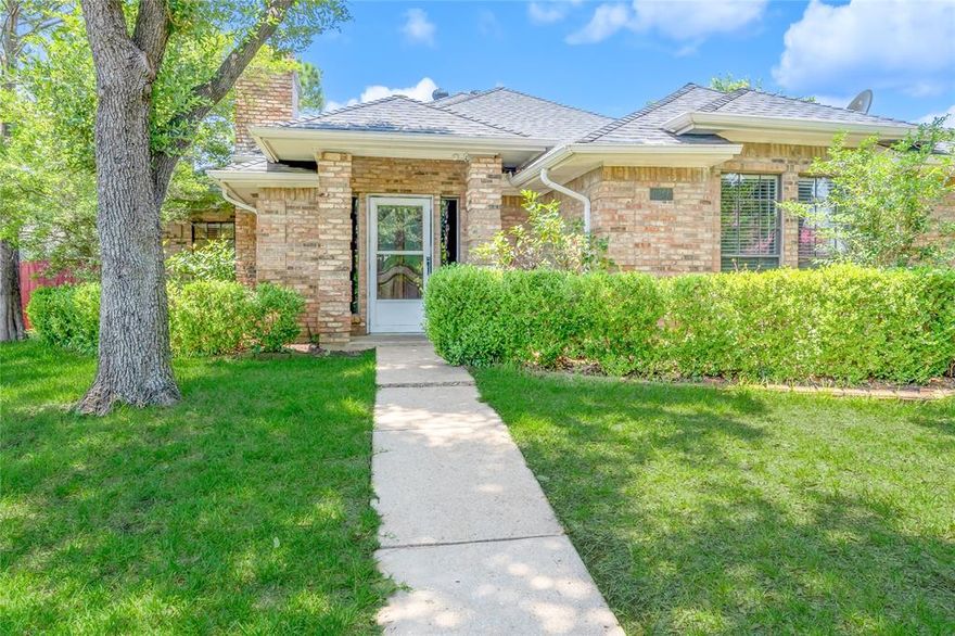 Welcome home to this recently updated 3 bed 2 bath corner lot property! This large lot welcomes plenty of vegetation and two fenced yards! New luxury vinyl flooring throughout the living areas and bedrooms with ceramic tile in the bathrooms. Trey ceilings in the cozy living room, with a wood burning fireplace, and vaulted ceilings in the primary bedroom. The primary bathroom boasts a garden tub, two vanities, two sinks, a separate shower, and a walk-in closet! Soak up the rays in the warm grand sun room. Close to major shops and dining, Six Flags, Hurricane Harbor, AT&T Stadium, Globe Life Field, and much more. Schedule your showing today!