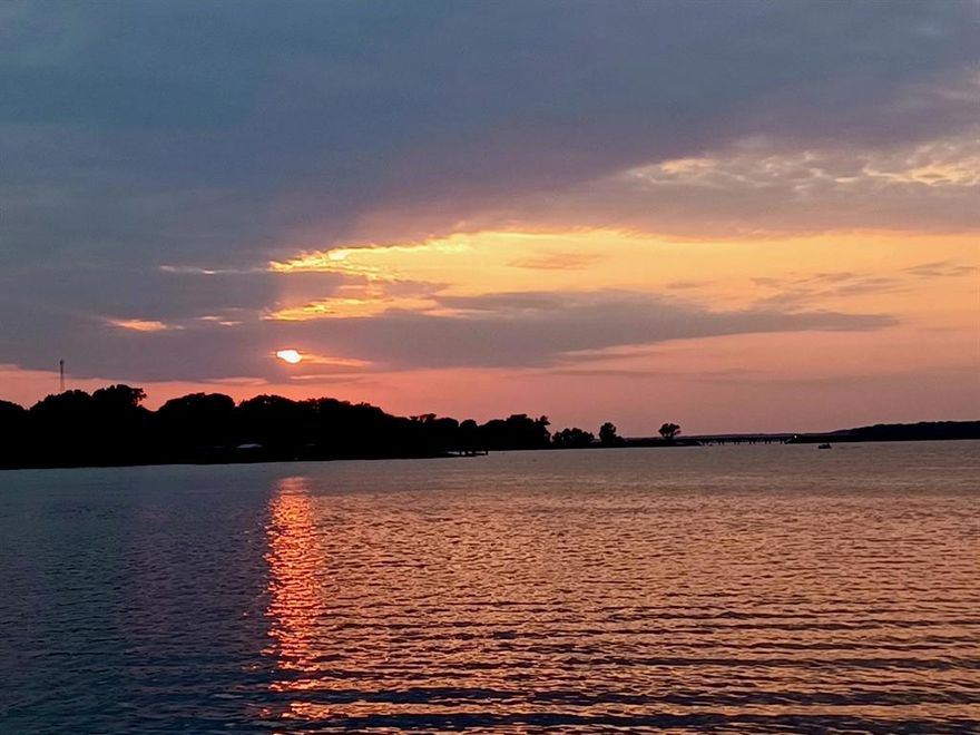 Wake up each day to sweeping views of Lake Tawakoni — a setting that instantly elevates your daily life. This waterfront property delivers what buyers want most: private shoreline access, room to relax, and a home designed to make the scenery part of your everyday experience.  The 2-bedroom, 2-bath residence features large windows that frame the lake from the moment you step inside. Natural light fills the kitchen, living, and dining areas, creating a warm, inviting space perfect for both quiet mornings and effortless entertaining. Outdoors, a spacious covered deck extends your living area and sets the stage for unforgettable sunset gatherings. Follow the path down to the patio and enjoy evenings by the outdoor fireplace as the water reflects the fading sky. Features also include, lake fed sprinklers, electric gated entrance, storage building with electric, New Roof recently installed, rain gutters, ring camera and much more. For buyers seeking a peaceful retreat with direct lake access and year-round enjoyment, this home offers a lifestyle that’s hard to match. Note:  Do Not Walk on Pier, repairs are needed to the decking.  Dining Table Is Included in Sale! Steps away from private community park with boat ramp for owners.