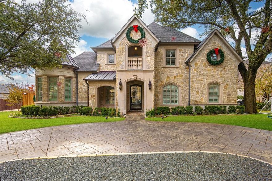 Welcome home to this incredible abode, that epitomizes elegance and modern comfort on a sprawling corner lot, in the heart of Lakewood. Immaculately maintained, this gorgeous home offers five bedrooms, four and a half bathrooms, and a host of luxurious features to suit any lifestyle. Upon entering, you're greeted by thoughtfully designed spaces, including an open-concept living area flowing seamlessly into the tastefully updated kitchen boasting marble countertops, stainless steel appliances, and an abundance of cabinet space. The primary suite impresses with dual vanities, spacious walk in shower, garden tub, and heated floors, complementing its spa-like atmosphere. The downstairs guest suite offers a private escape for company. Upstairs you'll find three additional bedrooms, two full bathrooms, a well appointed media room, game room currently being used as a gym and two charming balconies to enjoy the outdoors. Entertain effortlessly with a built-in Sonos system, wine cellar, and two wet bars. Outside, the heated saltwater pool, turfed backyard with putting green, covered patio and built-in grill create the perfect oasis for relaxation and gatherings. A new electric gate secures the three-car garage, complete with a double electric car charger. Recent updates, including three new HVAC systems, ensure ultimate comfort throughout the year. Just one block from Lakewood Elementary, minutes to White Rock Lake and downtown Dallas, and all the shopping and dining that the area has to offer, this home is a true masterpiece of modern luxury with the convenience of being in the center of it all!