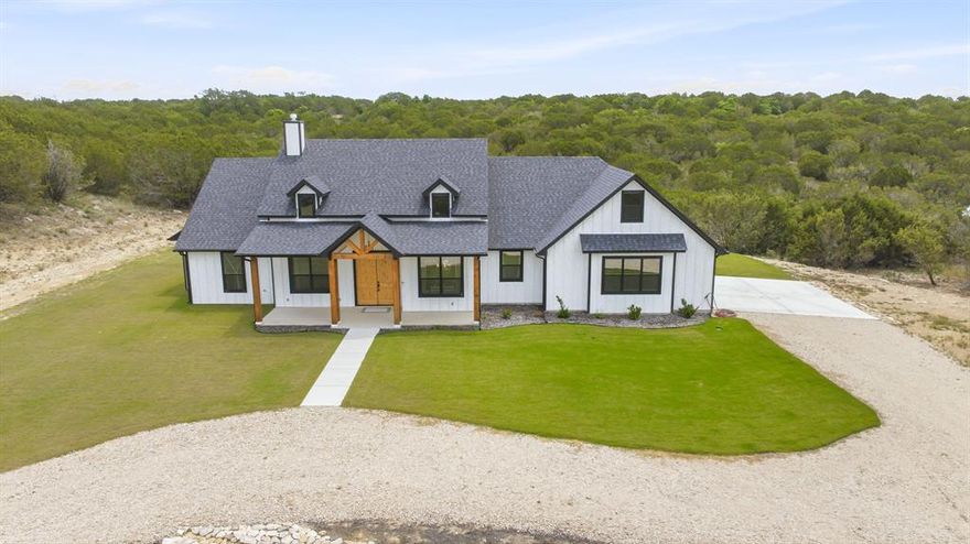 Welcome to this like-new custom home perfectly situated on 5 beautiful acres just blocks from the Anglers Cove fishing lake. This stunning 3-bedroom, 2.5-bath home offers the perfect blend of luxury, comfort, and country living. Step inside to an open-concept design featuring quartz countertops throughout, custom soft-close cabinetry, premium Café appliances, and high-end lighting and fixtures. The kitchen is a true showstopper with a large farm sink, oversized island, custom vent hood, undermount cabinet lighting, and a spacious butler’s pantry complete with butcher block countertops.
The oversized laundry and utility room offers abundant cabinetry, a second sink, and refrigerator freezer plumbing for added convenience. Retreat to the custom walk-in closets with extensive shelving and enjoy spa-like bathrooms featuring double vanities, custom mirrors, a soaking tub, and walk-in shower. Built for efficiency and comfort, the home is foam insulated and includes easy-access attic storage with staircase entry. Outside, you’ll find expansive front and backyards with lush Bermuda grass, a sprinkler system, and a covered south-facing patio complete with an outdoor propane hookup for your BBQ setup. Enjoy peaceful country living with upscale finishes, modern amenities, and easy access to fishing and outdoor recreation. Residents of Mountain Lakes enjoy access to a recreational lake, fishing lake, clubhouse, community pool, park, walking path, community garden, and RV park.