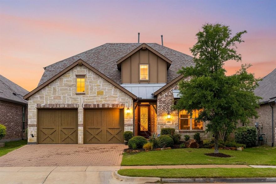 Stunning home with striking stone elevation, and upgraded landscaping is ideally located in the highly sought-after master-planned community of The Tribute. Thoughtfully designed with both everyday living & entertaining in mind, this 4-bedroom, 4-bath home offers an exceptional blend of elegance, comfort, and upgraded functionality.Step inside to discover a spacious and versatile layout featuring a private study, formal dining room, inviting family room, and a light-filled kitchen and breakfast area, all enhanced by soaring ceilings and abundant natural light. The open concept living area creates the perfect gathering space, seamlessly connecting to the chef’s kitchen. The kitchen is both stylish and highly functional, showcasing cabinetry extended to the ceiling, soft-close drawers, a convenient trash pullout in the island, and a huge walk-in pantry for exceptional storage. A built-in hutch adds versatility, perfect for additional storage, a wine station, or a stylish coffee bar! Plantation shutters throughout the downstairs add timeless sophistication and privacy. The extended primary suite provides a true retreat, complemented by a beautifully appointed bath featuring a separate shower and soaking tub, split vanities with granite countertops, & a dedicated vanity  with knee space, along with enhanced closet storage. Upstairs, an expansive entertainment rooms create the ideal space for movie nights, game days, or hosting guests. 
Outdoor living is elevated with an extended covered patio, offering the perfect setting for relaxing evenings or gatherings year-round. The oversized 2-car garage includes an additional 2-foot extension in length, providing extra storage or flexibility for larger vehicles. The Tribute residents enjoy a resort-style lifestyle surrounded by scenic golf courses, community pools, parks, pickleball courts, walking trails, and more. Convenient access to Highway 121 and the Dallas North Tollway makes commuting and daily conveniences effortless.