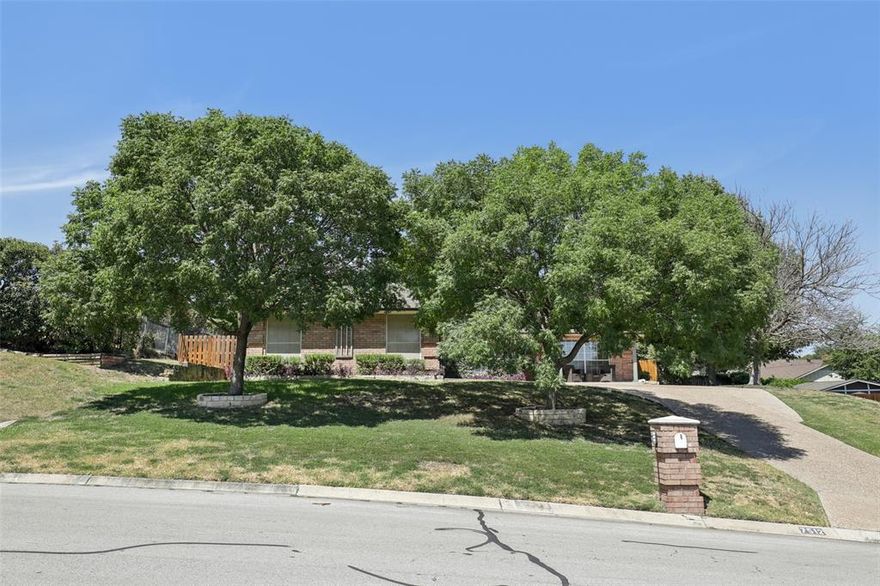 Nestled on a quiet and picturesque cul-de-sac, this beautiful single story Fort Worth home offers the perfect blend of charm, functionality, and location. Just minutes from the sparkling waters of Eagle Mountain Lake, it’s an ideal retreat for those who love both relaxation and recreation.
Inside, the kitchen is a true showpiece with sleek granite countertops and exquisite custom woodworking on the cabinetry, offering warmth and elegance for both everyday living and entertaining. The thoughtful design continues with custom closet systems that maximize storage and organization throughout the home. Step outside to your private backyard oasis, where a lovely pergola creates the perfect setting for morning coffee, weekend cookouts, or evening gatherings under the Texas sky. This home combines timeless details with everyday comfort. Located near top-rated Lake Country Schools you won't want to miss this one.