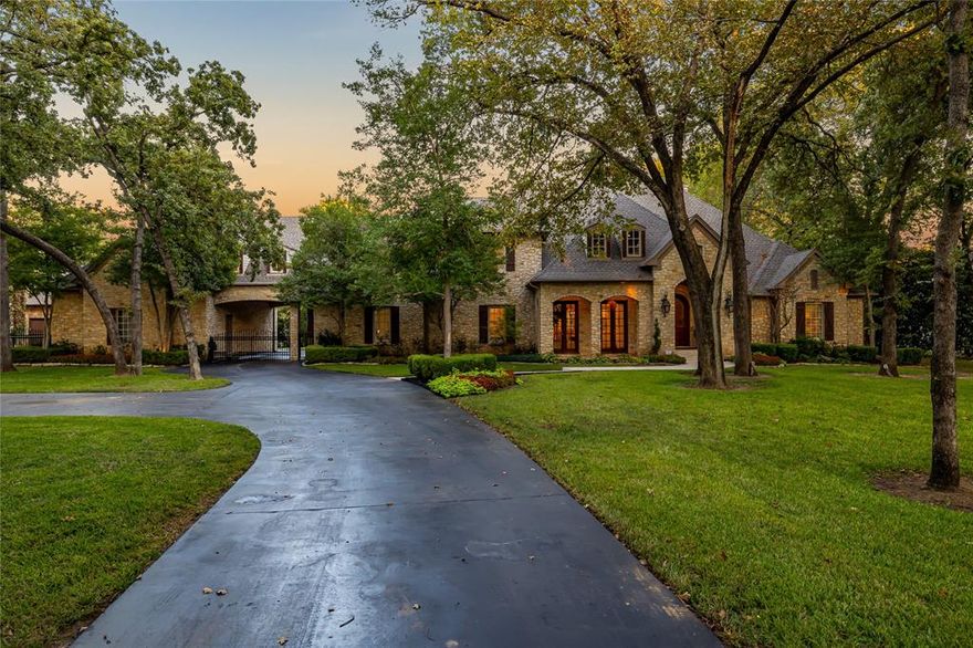 Welcome to a rare opportunity to own a truly exceptional Estate Home, perfectly situated on 2.9 secluded acres in prestigious Colleyville, on a beautiful, quiet street. This residence is an unparalleled blend of architectural beauty, refined luxury, and resort-style living, designed for the discerning homeowner who values both grand entertaining and private tranquility. Offering 6 generously sized bedrooms and multiple living areas across an expansive floorplan, the home's heart is the gourmet dream kitchen, featuring a commercial-grade gas range, custom cabinetry, and a huge center island, all while providing stunning, light-filled views of the patio and pool area. The stunning glass-door game room serves as a year-round retreat, complete with a fireplace bar area, making it perfect for intimate gatherings or holiday events. Adding to the estate's exceptional versatility and appeal is a beautifully appointed, fully self-contained Private Guest Suite. Perfect for luxurious guest accommodations, this suite includes a spacious living area and kitchen, ensuring complete comfort and privacy. The resort-style grounds are anchored by a sparkling swimming pool and features a outdoor grill and bar with a substantial covered dining. Beyond the main residence, discover the incredible ultimate lifestyle bonus: a dedicated Barn structure featuring a fully equipped Man Cave, ideal for collectors, hobbyists, or as a private entertainment hub and a dedicated garage with six additional parking spaces! Car enthusiasts and modern families will further appreciate the attached four-car garage, with epoxy flooring and ATV door! This estate offers complete privacy and peaceful suburban living while maintaining convenient access to Colleyville's top-rated schools, fine dining, and boutique shopping. Experience luxury where every detail has been thoughtfully curated; this is more than a home—it is a lifestyle investment.