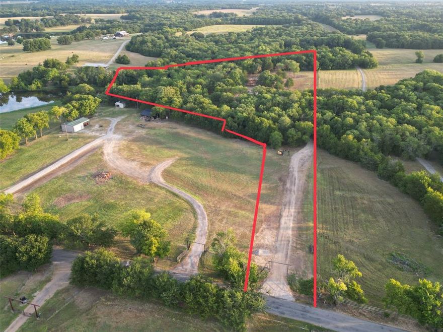 Discover the perfect balance of open space and natural beauty on this 10-acre tract just minutes from Highway 121, offering quick access to McKinney, Bonham, and surrounding areas. The property has been thoughtfully cleared, leaving just the right amount of mature trees to ensure privacy and shade. Position your dream home among the trees with scenic views of the water. Enjoy peaceful afternoons fishing the private pond or simply taking in the serene country surroundings. Whether you’re planning a weekend retreat, full-time residence, or hobby farm, this property offers endless possibilities with utilities available nearby. Utilities at the road.