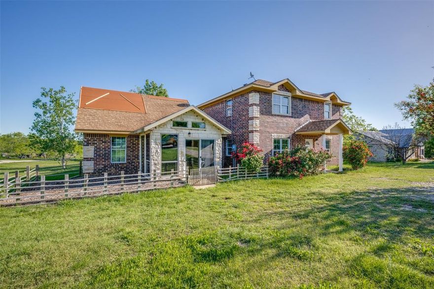 Get away from it all!  Situated close to Lake Ray Roberts, this home offers plenty of potential and possibilities.  Your main house features 3 bedrooms, 2 full baths and one half bath.  Whether you are entertaining or simply enjoying the family, this may be what you've been looking for.  Generous living area for Friday night movies or family game night, formal dining for entertaining or quiet evening meals and a great kitchen for prepping holiday meals.  At the end of the day, slip away to the privacy of your own suite with private bath. All bedrooms are upstairs providing plenty of privacy for those sleepy weekend mornings.  As a bonus, there's an attached guest house.  With apprx. 500 sq.ft (more or less), the guest house has a kitchenette, full bath, sitting area and one bedroom.  This could be a great place for parents, teens or guests.  With apprx. 1 acre this could be the ideal spot for weekend BBQ's, family gatherings or the veggie garden you've been wanting.