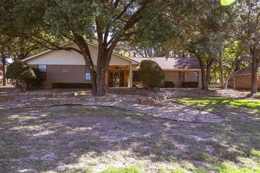 Super cute property with lots of shade, trees in front and in the back of this 2 bedroom, 3 bath , 2 car garage home with an oversized enclosed back porch that is across the back of home.   Home needs updating, great location on Westover making it easy to go to front or back gate of Pecan and easy access to golf courses, shopping in Pecan and recreation.   Pecan Plantation offers, golf, community pools, community clubhouse, tennis courts, walking and jogging paths, airport, shopping, banking, new ACE hardware store inside the gates.   Ride your golf cart everywhere and never have to leave the community.   The backyard of this home is shaded and faces away from the evening sun for cool relaxing evenings.   Come check this home out and remodel and update it and make it your own.   Home square footage does not include the enclosed sunroom, if you heated or cooled it you could add to your square footage.   Perfect for investor or someone wanting to downsize.