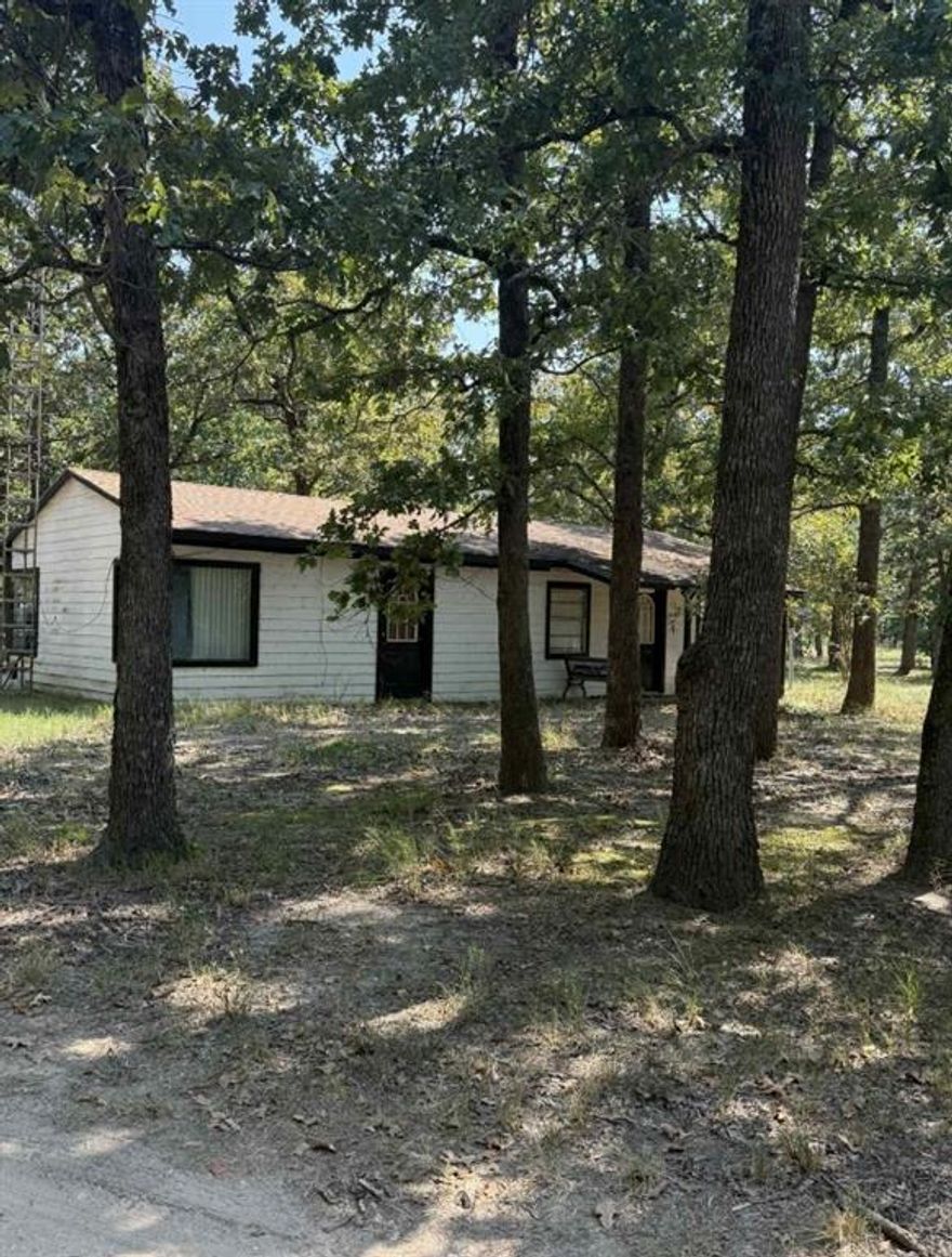 Majestical 12+ Acres, Full of Hardwoods and 2 Large Ponds at the back. Fenced on 3 Sides.  Offers a small Farmhouse and a Singlewide Mobile Home for Guest. Very pretty Gated and Pipe Entrance. Small home has 2 Bedrooms and 1 Full Bath, Living Room and Kitchen with Dining Area. Drink your coffee on the Front Porch. Workshop is 36 X 40 with electricity. 2 Car Carport for Parking. Country Setting and Secluded and Quiet. Bring your ideas and make this home!