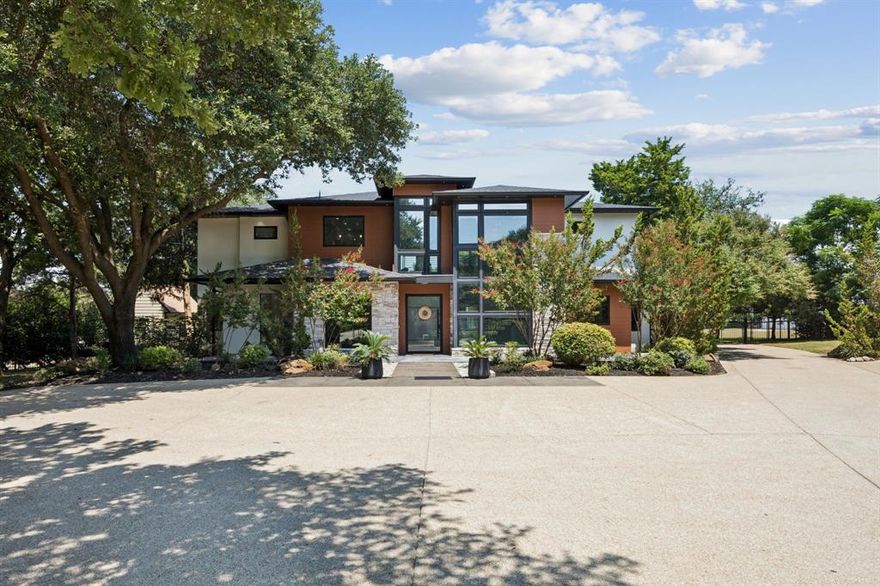 Discover timeless luxury & thoughtful design at 1006 Quail Run Road, a fully reimagined 9,763 sqft estate situated on a beautifully treed 2.56 acre lot in the heart of Southlake's Quail Creek Estates. Originally built in 1987 & extensively renovated from 2021–2025 by the current owners in partnership with Bohanon Design Team, this 7-bed, 10-bath residence blends sophisticated & clean-lined architecture with top-tier infrastructure & finishes. From the moment you enter, you’re greeted by natural light & sweeping views, thanks to 124 Anderson E-Series windows throughout. The home showcases a commissioned walnut-and-steel staircase & oversized kitchen island by Stahl Custom Lumber. The residence features 3.5 distinct kitchen & prep areas including a full main kitchen, an entertainment suite-MIL setup, outdoor kitchen & upstairs parlor. Interior highlights include 10ft ceilings, a Level 5 sheetrock finish, quartz window ledges, in-wall vacuum system with Hide-A-Hose tech, connections for 2 washer-dryer sets, hand-scraped white oak floors upstairs & finished concrete on the ground level—no carpet throughout. Cat-V wiring, Google Fire-Emissions detection & Savant media systems elevate everyday living, while sound-dampening insulation ensures privacy across all living & entertainment zones. Every detail was upgraded—95% of wiring, all plumbing including a fire suppression system, four new HVAC units, foam encapsulation from roof to base & central steel beams designed to exceed 5x load requirements. The outdoor oasis is just as impressive. The backyard features a 45,000-gallon, 10ft deep pool & spa with recently upgraded saltwater equipment, a custom Ipe diving dock, lush landscaping with mature oaks & Japanese maples & a turf athletic field with walking track & bleachers installed by the same professionals behind the Frisco Star. With no expense spared & no detail overlooked, this is truly a rare opportunity to own a contemporary, one-of-a-kind estate in Southlake, Texas.