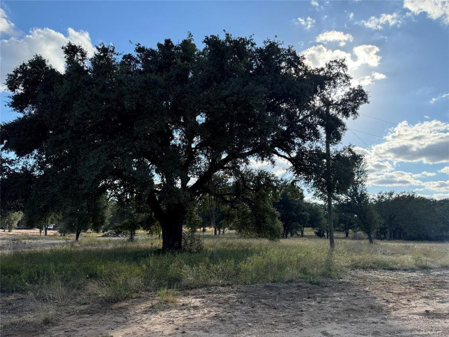 Looking to build in Gatesville, TX? This 1.97-acre, build-ready lot is the perfect opportunity for anyone wanting to construct a custom home or barndominium in one of Central Texas’ most desirable small towns. Located just off Highway 36, this property provides quick and convenient access to Waco, Temple, Killeen, and Fort Hood, ideal for homeowners, commuters, and investors seeking land for new construction in Gatesville. This gorgeous Gatesville homesite features a gently rolling landscape dotted with large, mature oak trees, giving you multiple prime locations for your build. Whether you're planning a modern farmhouse, traditional home, metal barndo, or investment property, the land’s natural layout makes it easy to design the perfect setup. What sets this tract apart from other land for sale in Gatesville is the full utility availability, a major advantage for anyone preparing to build. Fort Gates Water, City of Gatesville sewer, and Hamilton Electric are already in place or available at the front of the lot, significantly reducing development costs and timelines. With nearly two acres, you’ll have plenty of room for a home, workshop, barn, garden, or even a few animals. The quiet, country setting paired with easy city access makes this one of the best spots for building in Gatesville, TX. If you're searching for land to build on in Gatesville, this property checks every box.
Call today to tour this rare, ready-to-build homesite