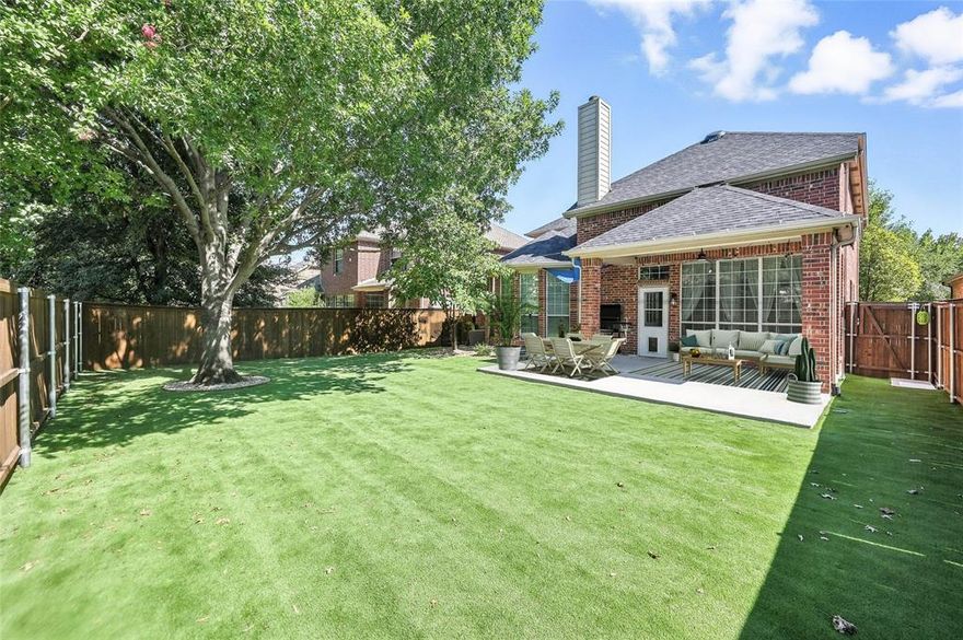 BEAUTIFULLY UPDATED 2 STORY WITH ROOM FOR THE WHOLE FAMILY ON A QUIET STREET! There are many memories to be made in this stunning home graced with fresh paint, extensive wood-look tile flooring, LED lighting, wrought iron spindles, decorative light fixtures and an open-concept floor plan. Enjoy gatherings in the spacious family room featuring flat screen wiring, a floor-to-ceiling stone fireplace and surround sound wiring, or inspire your inner chef in the modern kitchen including quartz countertops, recently installed stainless steel appliances, a 5 burner gas cooktop, subway tile backsplash, tons of cabinets for storage, an island and a pantry. End your day in the remodeled primary suite showcasing a sliding barn door, updated vanities and flooring, a frameless shower, jetted tub, bay window sitting area and a walk-in closet. Upstairs you will discover plenty of space to entertain in the huge game room and private media room with dimmable lighting. Unwind in your low-maintenance backyard offering artificial turf grass and a large covered patio with a ceiling fan. Recently replaced 20-gauge steel front door, roof with class 4 shingles, fence, garage door openers & garbage disposal. Lantana residents have access to community pools, trails, fitness centers, tennis, pickleball, playgrounds, community events, and more! Close proximity to schools, Kroger Marketplace, CVS, Marty B’s, The Barrel, The Bartonville Store and The Shops of Highland Village.