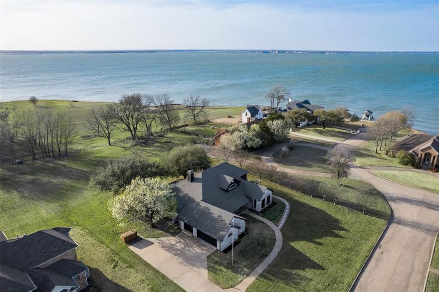 Modern luxury with serene lakeviews from almost every corner of the home and sits on approximately 1 acre.  This remodeled custom home features generous living spaces which include a gourmet kitchen offering custom cabinetry, granite countertops and waterfall island and stainless appliances including an induction cooktop.  The upper level is dedicated to the primary suite designed for ultimate relaxation offering panoramic views of the lake with walk in shower, freestanding tub, and a Jucuzzi FAR Theraputic Sauna.  Additionally there are many designer finishes throughout such as custom millwork on the walls, designer lighting, morning room with custom fireplace, sitting bench and built-ins in breakfast room, family room with fireplace and extended views of the lake, spacious utility room with laundry sink, and a dedicated office with built-ins and a private entrance.  Outdoor amenities include a large covered patio and a large gathering firepit which is perfect for entertaining, raised vegetable gardens, a custom 16 x 16 Aviary and hen house along with an outdoor sink.  Whether you're seeking a serene retreat or a vibrant gathering spot, this lakeside home delivers it all. Don't miss out on the opportunity to own this remarkable property and enjoy the ultimate lakeside lifestyle!