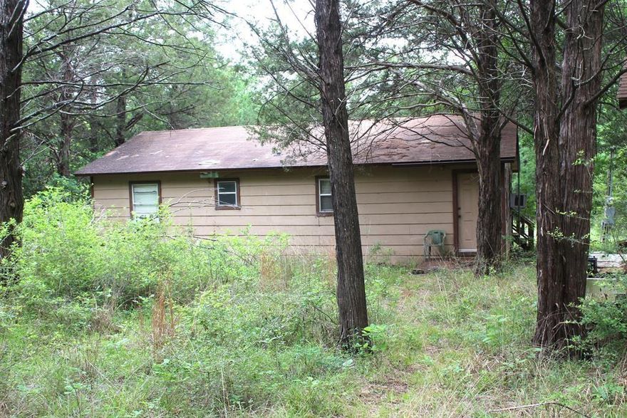 If you’re looking for a rustic space to hang out and play, this is for you! Two bedroom one bath cabin needs a bit of TLC. Three barns with power and lights are ready to store your boat, RV, four-wheelers, etc. Small storage building could be a she-shed! You could live here full-time or use this as your weekend getaway in the woods. There’s a creek with a sturdy bridge and another place with a cute covered walk bridge. Very secluded. An old fishing pier (needs repair) on a channel leading right out to Richland Chambers Reservoir open water. Owners are selling as is, make your own repairs. This is a great place to experience nature at its finest.