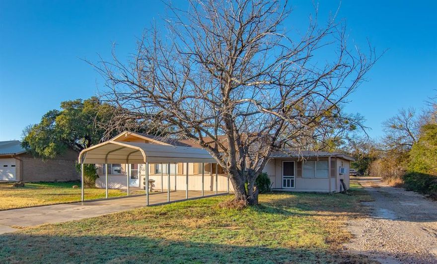 This seems to be a structurally sound property that needs a little cosmetic TLC. Perfect for an investment property to lease or flip. Lots of room for a midsized family. Large shaded back yard with a 16x36 metal garage that could be a workshop. Kitchen has been recently remodeled with the appliances to convey. The original garage was enclosed and two large bonus rooms added. The bonus rooms are serviced by window units, but the remainder of the house is serviced by central HVAC. One of the bonus rooms has an outside entrance. If you are looking for a project that will pay off, you need to take a look.