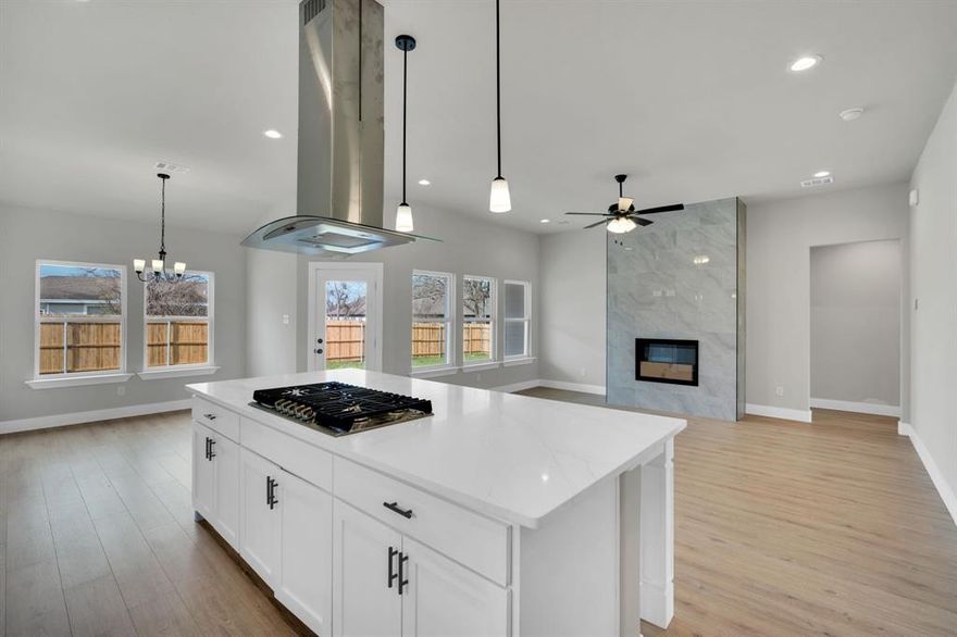 New Construction home - No HOA - in the Copper Penny Estates community in Palmer, TX! This stunning 4-bedroom, 2-bath home blends modern style with everyday comfort and is designed for both entertaining and family living.
The gourmet kitchen is truly the heart of the home, featuring a gas cooktop, exposed stainless steel vent hood, quartz countertops, abundant cabinetry, and a massive center island perfect for gathering. Luxury vinyl flooring flows throughout the main living areas, adding both durability and style.
The open living room and breakfast area are filled with natural light and highlighted by a dramatic floor-to-ceiling tiled electric fireplace with heat blower and multi-color flame options, creating a striking architectural focal point.
The private primary suite offers a tray ceiling, ceiling fan, and a spa-like en-suite bath complete with dual quartz vanities, soaking tub, separate shower, and a custom walk-in closet. A split-bedroom layout provides added privacy for the primary suite.
Step outside to a large fenced backyard with a covered patio—ideal for relaxing evenings or weekend entertaining. Additional features include a spacious utility room with cabinets, utility sink, and drip area for added convenience.
Located in the charming Copper Penny Estates community in Palmer, TX.